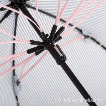 美しい雨や風に強い女性の傘